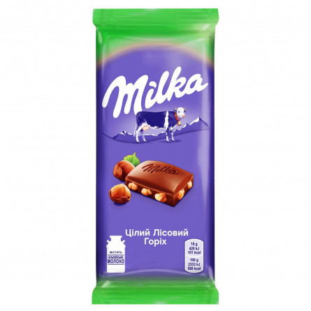 Шоколад молочный Milka с цельными лесными орехами 90г slide 1