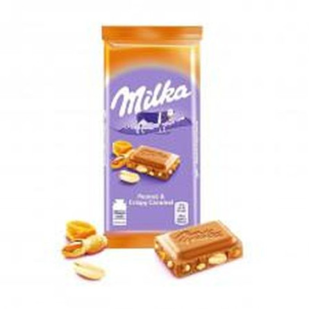 Шоколад Milka молочный карамель с арахисом 90г slide 1